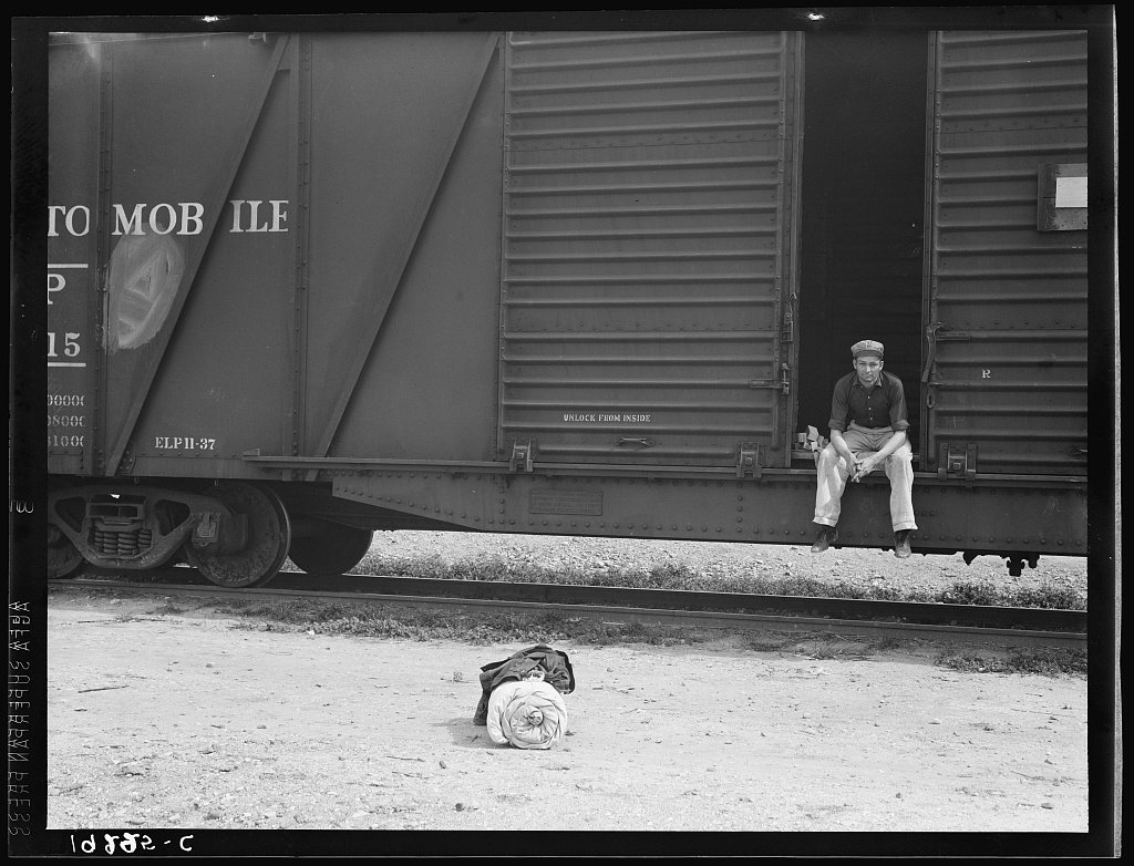 Car on siding across tracks from pea packing plant. Twenty-five year old itinerant, originally from Oregon. "On the road